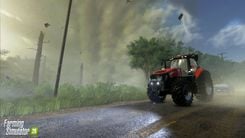 red tractor in front of a storm